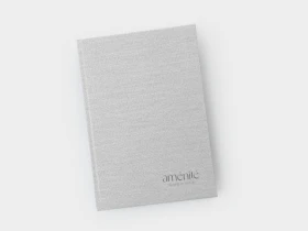 Light-coloured A5 weekly diary in a hard cover with personalised logo