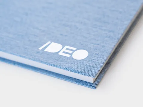 Close-up of a blue A5 diary hard cover with white logo
