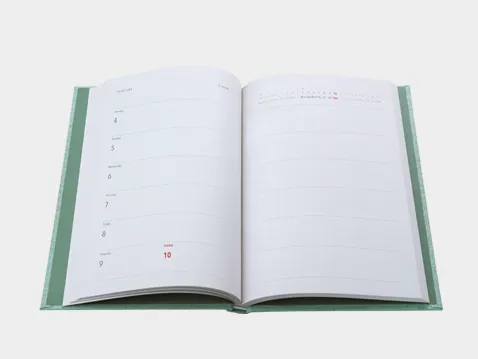 Open A5 weekly diary in a green hard cover