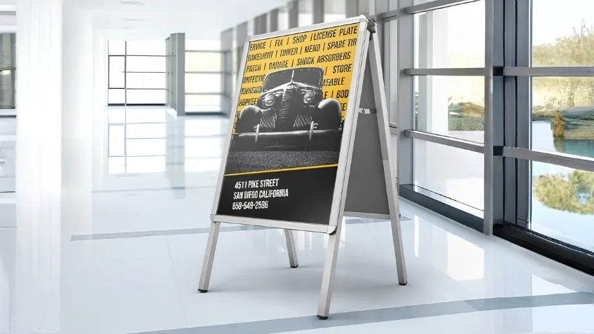 Aluminium advertising A-board with a poster placed indoors