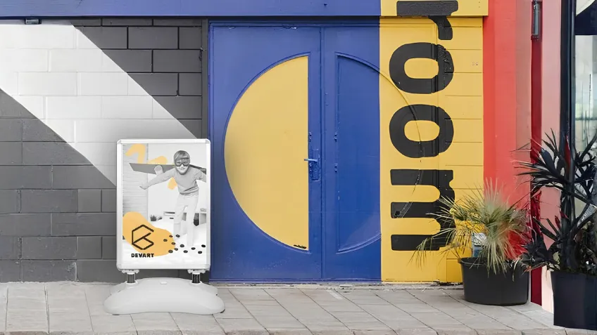 Advertising A-board with weighted base and print placed in front of a premises