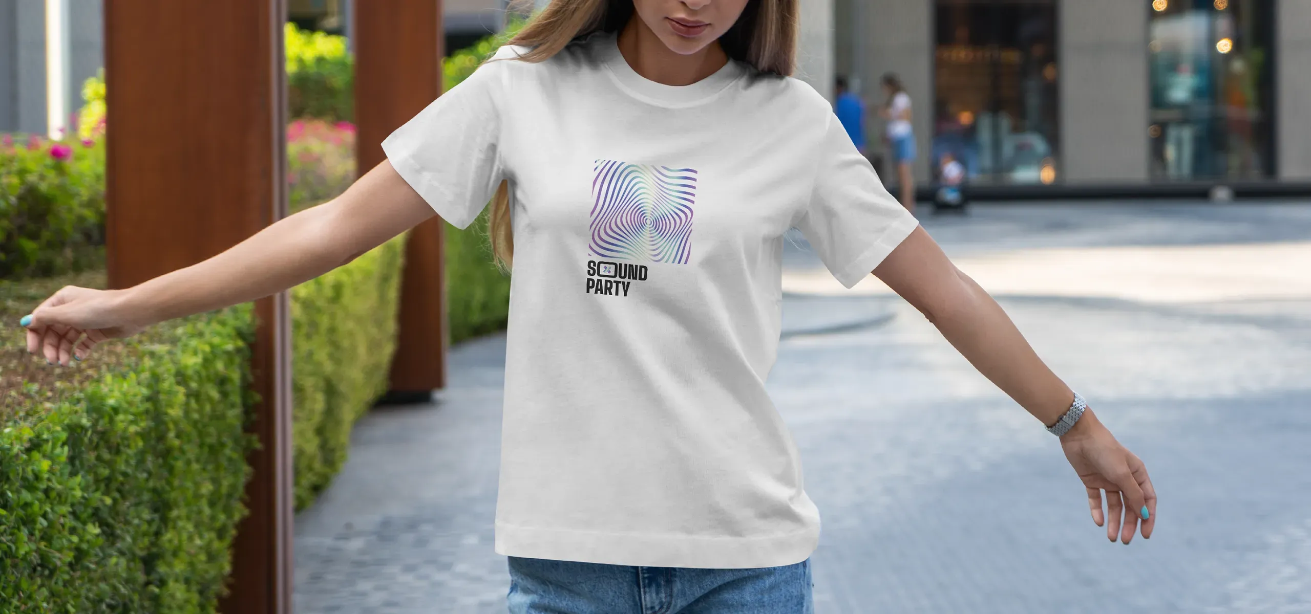 White women's T-shirt with personalised print shown outdoors