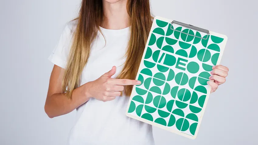 Personalised A4 clipboard with green print held in hands