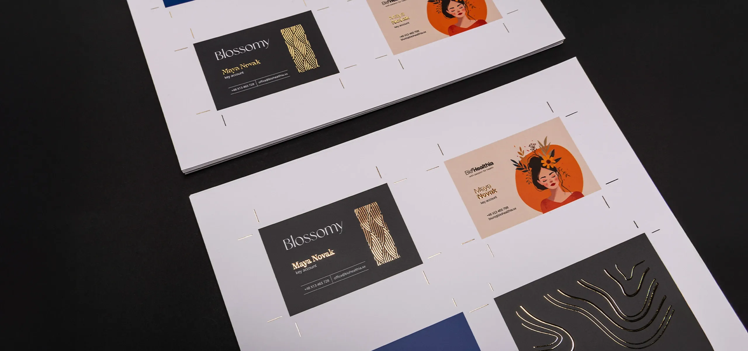 Two printed sheets with various business card and advertising material designs