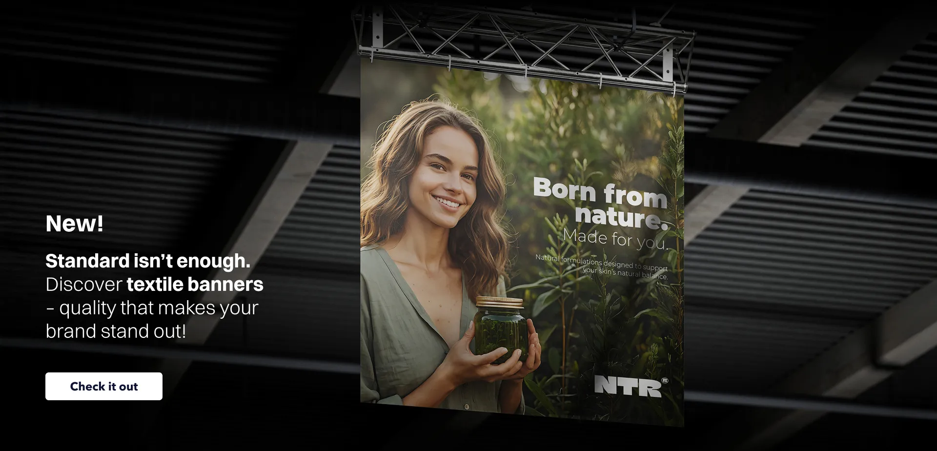 Website banner promoting textile banners with the text “New! Discover textile banners – quality that makes your brand stand out”