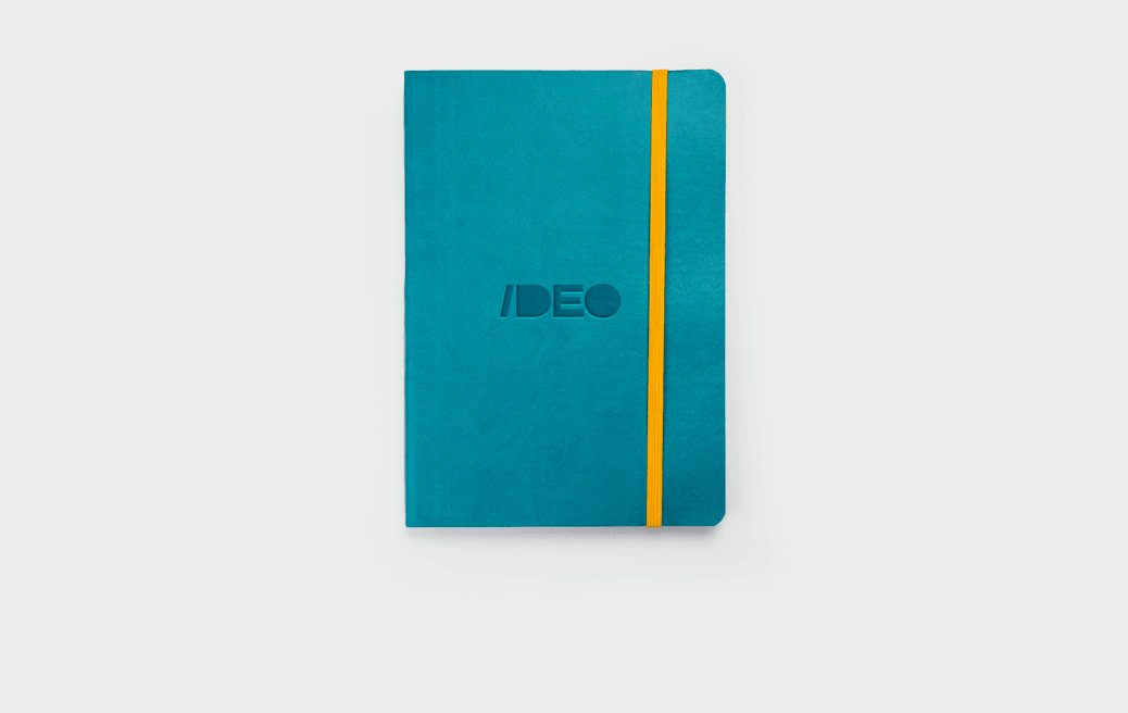 Turquoise A5 daily diary in a soft cover with logo and yellow elastic band