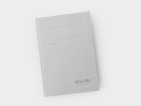 Light-coloured A5 weekly diary in a hard cover with personalised logo